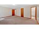 Bright bedroom with neutral carpet and several wooden doors at 328 West Ln, Woodstock, GA 30188