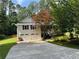 Charming two-story home with a well-manicured lawn and a two-car garage at 328 West Ln, Woodstock, GA 30188