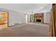 Open living room features a stone fireplace, neutral carpet, and ample natural light at 328 West Ln, Woodstock, GA 30188