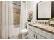 Bright bathroom featuring granite countertop, vanity, and a shower with decorative tile and curtain at 3291 Meadow Lily Ct, Buford, GA 30519