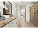 Light-filled bathroom with dual sinks, granite countertops, a shower, and lots of space at 3291 Meadow Lily Ct, Buford, GA 30519