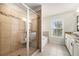 Stylish bathroom with a glass-enclosed tiled shower and garden tub with granite countertops at 3291 Meadow Lily Ct, Buford, GA 30519