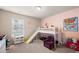 Bright bedroom featuring a loft bed with a slide, a cozy reading nook, and playful decor at 3291 Meadow Lily Ct, Buford, GA 30519