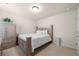 Traditional bedroom with wooden furniture, including a queen-sized bed and decorative bedside pedestal at 3291 Meadow Lily Ct, Buford, GA 30519