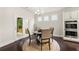 Eat-in breakfast nook with stainless steel double oven, bright windows, and doorway to covered patio at 3291 Meadow Lily Ct, Buford, GA 30519