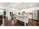 Spacious kitchen with stainless steel appliances, white cabinets, and center island at 3291 Meadow Lily Ct, Buford, GA 30519