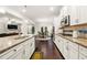 Modern kitchen featuring stainless steel appliances, granite countertops, and an open layout at 3291 Meadow Lily Ct, Buford, GA 30519