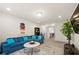 Comfortable living room with blue sofa and accent lighting, creating a relaxing atmosphere at 3291 Meadow Lily Ct, Buford, GA 30519