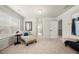 A well lit loft with carpet flooring and reading nook at 3291 Meadow Lily Ct, Buford, GA 30519
