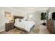 Comfortable bedroom featuring carpet, a king-sized bed, natural light, and neutral tones at 3291 Meadow Lily Ct, Buford, GA 30519