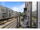 Cozy balcony with chair overlooking a street view of neighboring townhomes at 415 Gartrell Se St # 15, Atlanta, GA 30312