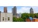 View of the city from the rooftop deck, overlooking the nearby buildings and trees at 415 Gartrell Se St # 15, Atlanta, GA 30312