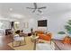 Open floor plan with stylish living room featuring hardwood floors, orange couch, and modern decor at 415 Gartrell Se St # 15, Atlanta, GA 30312