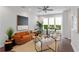 Cozy living room with a comfortable orange sofa, modern decor, and a large window offering a pleasant view at 415 Gartrell Se St # 15, Atlanta, GA 30312