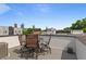Rooftop deck has outdoor seating, table, and furniture with a view of the city at 415 Gartrell Se St # 15, Atlanta, GA 30312