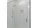 Bright shower features white subway tile, glass door and shower door, built in shower shelf, and tile flooring at 415 Gartrell Se St # 15, Atlanta, GA 30312