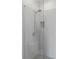 Modern glass-enclosed shower with gray tile and chrome fixtures at 415 Gartrell Se St # 15, Atlanta, GA 30312