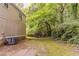 The grassy backyard is partially wooded, offering privacy at 482 Tarragon Sw Way, Atlanta, GA 30331