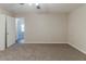 Neutral carpeted bedroom with a ceiling fan and ensuite bath at 482 Tarragon Sw Way, Atlanta, GA 30331
