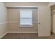 Bedroom featuring neutral carpeting and a window with blinds at 482 Tarragon Sw Way, Atlanta, GA 30331