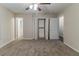 Spacious bedroom with carpet, ceiling fan, closet, and ensuite bath at 482 Tarragon Sw Way, Atlanta, GA 30331