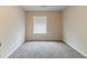 Bedroom featuring neutral carpeting and a window with blinds at 482 Tarragon Sw Way, Atlanta, GA 30331