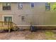Back exterior of the home with a deck and lush backyard at 482 Tarragon Sw Way, Atlanta, GA 30331