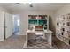 Inviting home office with custom built-in bookshelves, plush carpet, and lots of natural light at 482 Tarragon Sw Way, Atlanta, GA 30331