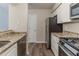 Functional kitchen with stainless steel appliances, granite countertops, and plenty of storage at 482 Tarragon Sw Way, Atlanta, GA 30331