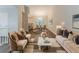 Elegant living room featuring a view into the dining area, hardwood floors, and neutral paint at 482 Tarragon Sw Way, Atlanta, GA 30331