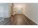 Open-concept living room featuring hardwood floors and a modern chandelier at 482 Tarragon Sw Way, Atlanta, GA 30331