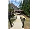 Covered outdoor structure perfect for entertaining in a private and serene backyard setting at 716 Bethpage Dr, Mcdonough, GA 30253