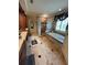 Bathroom boasting a tub, glass block shower, and wood cabinets at 716 Bethpage Dr, Mcdonough, GA 30253