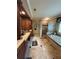 Bathroom boasting a tub, glass block shower, and wood cabinets at 716 Bethpage Dr, Mcdonough, GA 30253