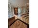Bathroom with tiled floors and glass block walls leading to the vanity and mirror area at 716 Bethpage Dr, Mcdonough, GA 30253