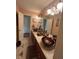 Bathroom featuring double sinks with bronze colored glass bowls, tiled floor, and decorative accents at 716 Bethpage Dr, Mcdonough, GA 30253