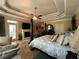 Bedroom featuring a sitting area, ceiling fan, and large windows with shutter at 716 Bethpage Dr, Mcdonough, GA 30253