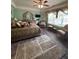 Well-lit bedroom featuring hardwood floors, large bed, sitting area, and ample natural light at 716 Bethpage Dr, Mcdonough, GA 30253