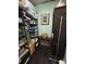 Organized closet with shelving for storage, and hanging rods for clothes and accessories at 716 Bethpage Dr, Mcdonough, GA 30253