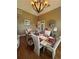 Formal dining room with elegant table setting and decorative lighting at 716 Bethpage Dr, Mcdonough, GA 30253