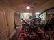 Home gym complete with workout equipment and an adjacent hot tub for relaxation at 716 Bethpage Dr, Mcdonough, GA 30253