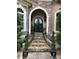 Elegant front entrance with stone steps, iron railings, and decorative planters at 716 Bethpage Dr, Mcdonough, GA 30253