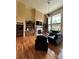 Bright and airy living room with large windows and a cozy fireplace at 716 Bethpage Dr, Mcdonough, GA 30253