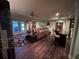 Inviting living room with a comfortable sofa, bar seating, and access to the outdoors at 716 Bethpage Dr, Mcdonough, GA 30253