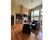 Bright and airy living room with hardwood floors, a fireplace, and large windows offering great views at 716 Bethpage Dr, Mcdonough, GA 30253