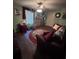 Comfortable living area featuring a cozy sofa, ceiling fan, and a warm rug for a welcoming space at 716 Bethpage Dr, Mcdonough, GA 30253