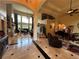 Open-concept living area with soaring ceilings, hardwood floors, and an abundance of natural light at 716 Bethpage Dr, Mcdonough, GA 30253