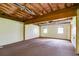 Unfinished basement with exposed ceiling and ductwork, two windows letting in light, and concrete walls ready to be finished at 118 Hunters Pl, Villa Rica, GA 30180