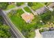 An aerial view showing a home with a brown roof and a well-maintained lawn with manicured shrubbery and mature trees at 3623 Doroco Dr, Atlanta, GA 30340