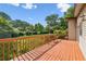 An outdoor deck with a wood railing and bench seating at 3623 Doroco Dr, Atlanta, GA 30340
